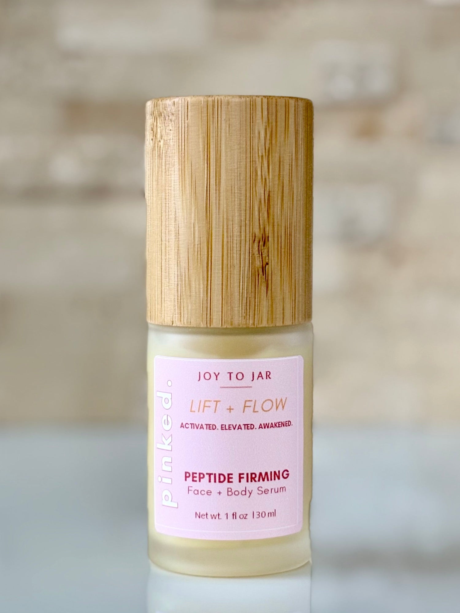 PINKED. Lift &amp; Flow Peptide Firming Face and Body Serum - Travel Size