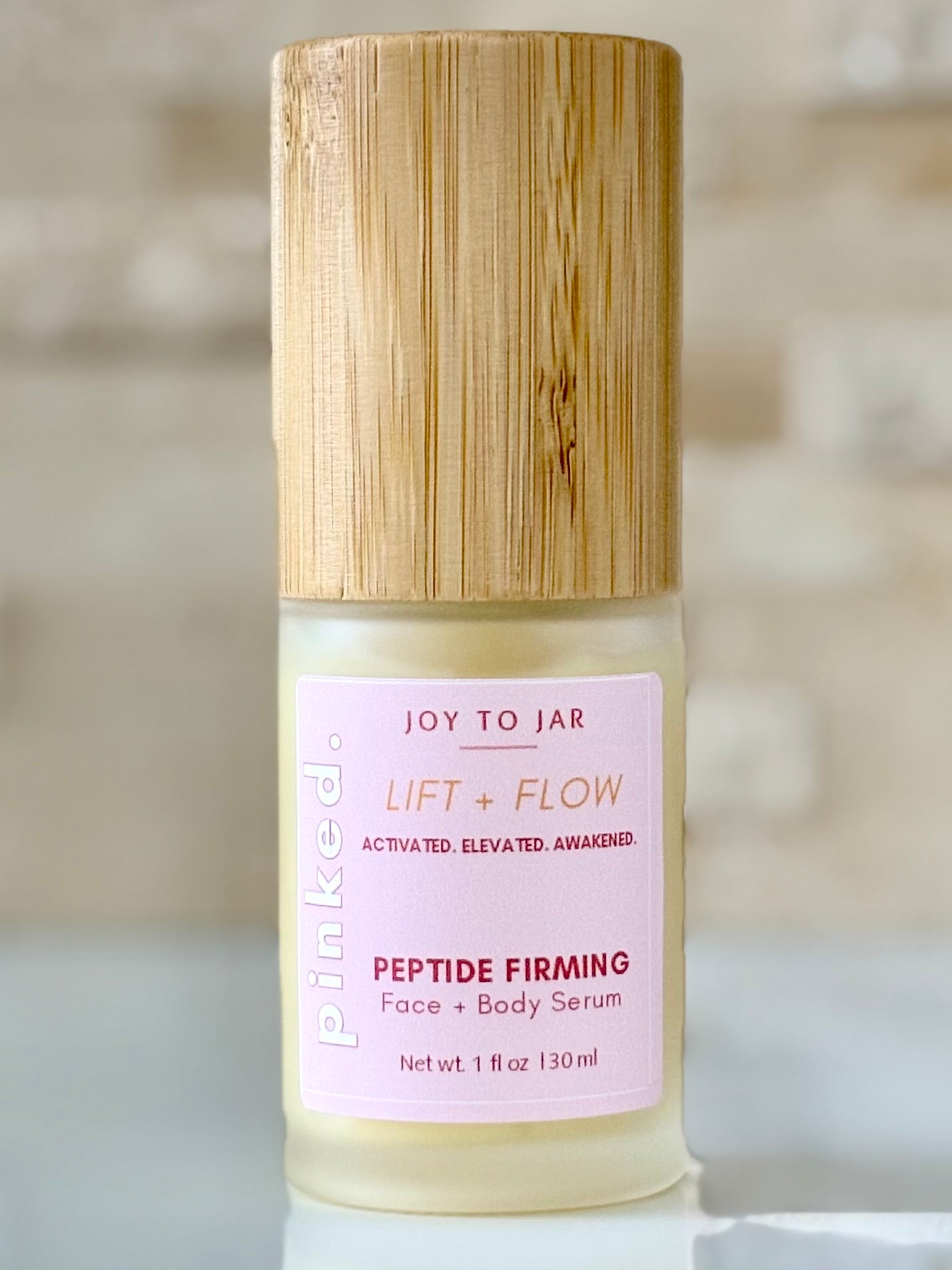 PINKED. Lift &amp; Flow Peptide Firming Face and Body Serum - Travel Size